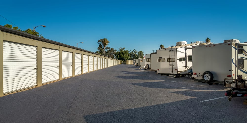 Drive-up units and RV parking on a beautiful sunny day at StorQuest Self Storage in Acampo, California