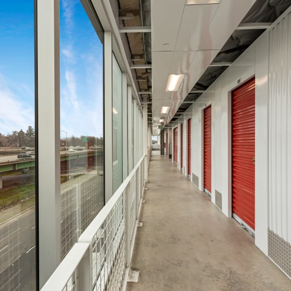 Red doors on indoor units at StorQuest Self Storage in Parrish, Florida