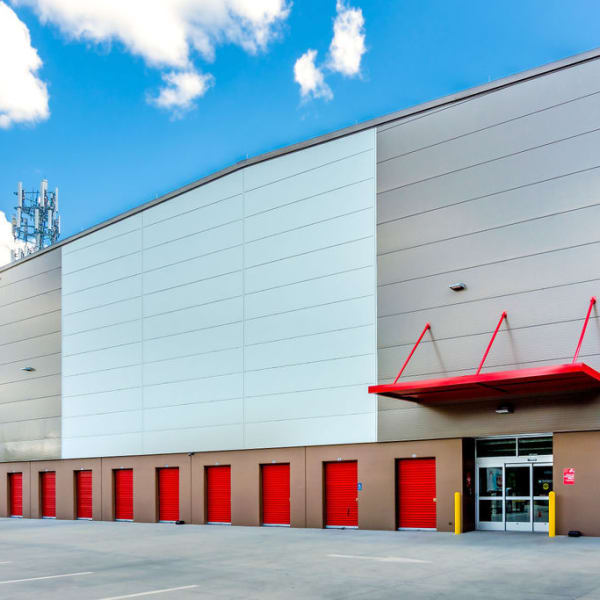 Outdoor storage units with bright doors at StorQuest Self Storage in Gainesville, Florida