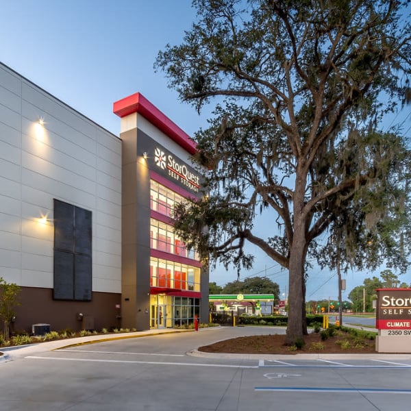 Exterior of StorQuest Self Storage in Gainesville, Florida at dusk