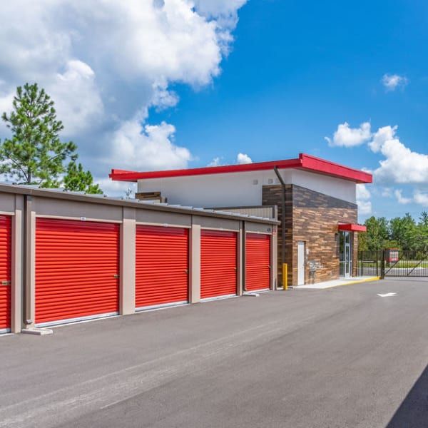 Red doors on outdoor units at StorQuest Express Self Service Storage in Palm Coast, Florida