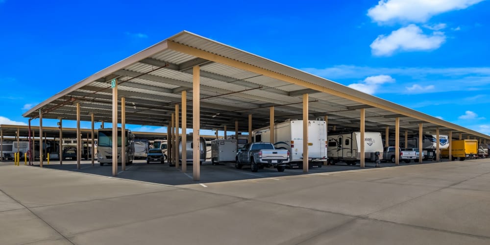 Covered outdoor RV, boat, and vehicle storage at StorQuest RV & Boat Storage in San Tan Valley, Arizona