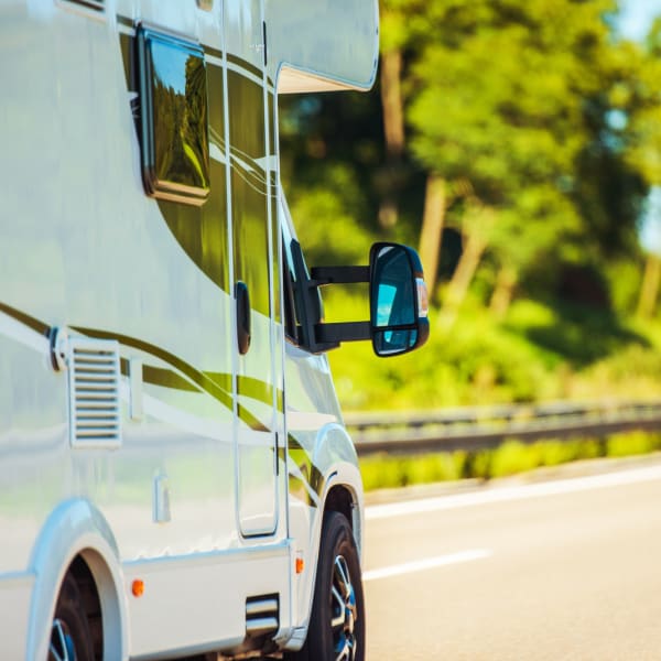 An RV driving down the road near StorQuest Self Storage in Ave Maria, Florida