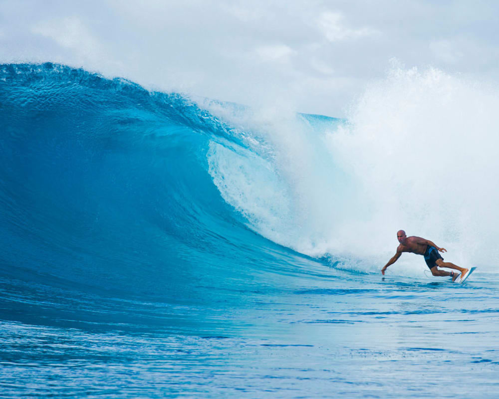 Kelly Slater World Champion Surfer catches a wave 