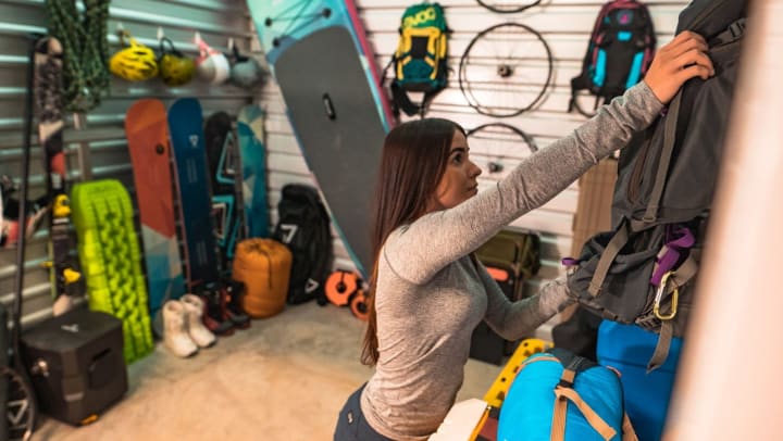 Person in a storage unit with rec. gear