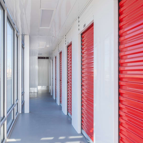 Red doors on indoor units at StorQuest Self Storage in Westbury, New York