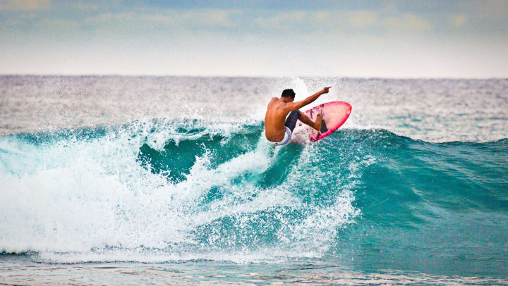 Man surfing a wave on the ocean