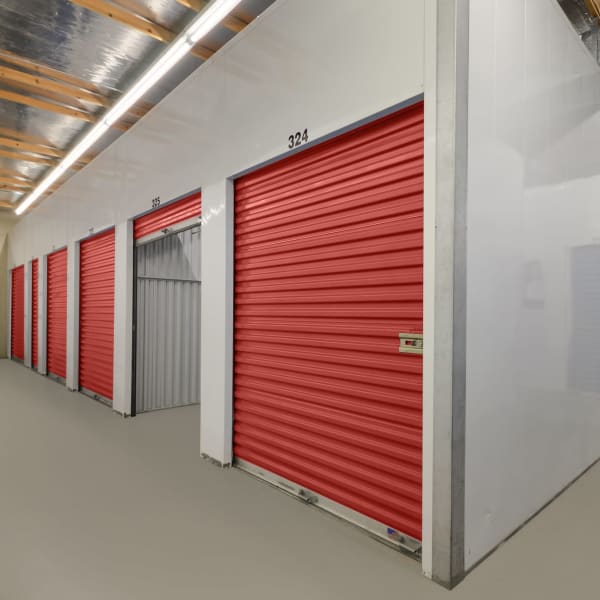 Indoor storage units with red doors at StorQuest Self Storage in Vallejo, California