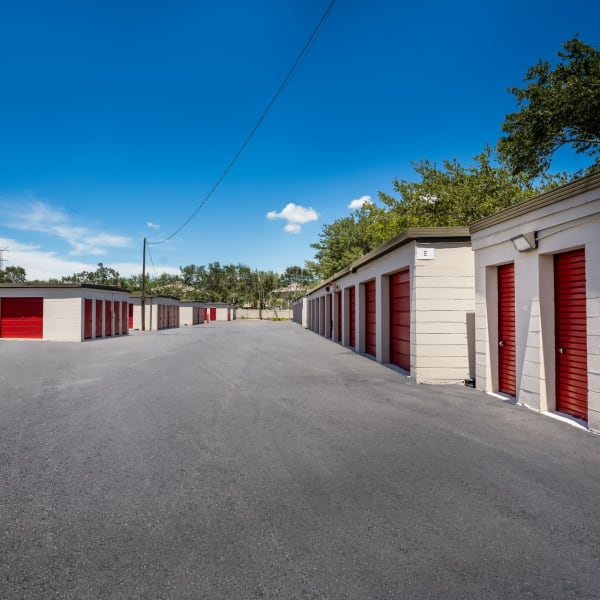 Outdoor storage units with bright doors at StorQuest Self Storage in Clearwater, Florida