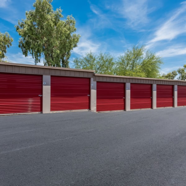 Outdoor storage units with bright doors at StorQuest Self Storage in Apache Junction, Arizona