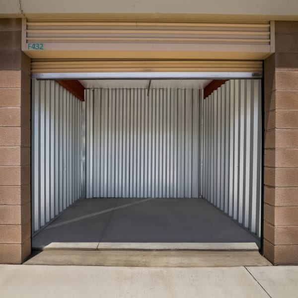 An outdoor storage unit with tan doors at StorQuest Self Storage in Cathedral City, California