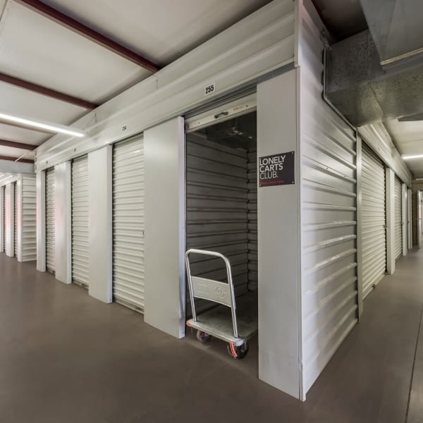 An open indoor storage unit at StorQuest Self Storage in Apache Junction, Arizona