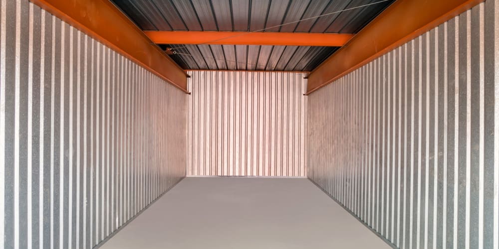 Inside a large indoor storage unit at StorQuest Self Storage in Glendale, Arizona