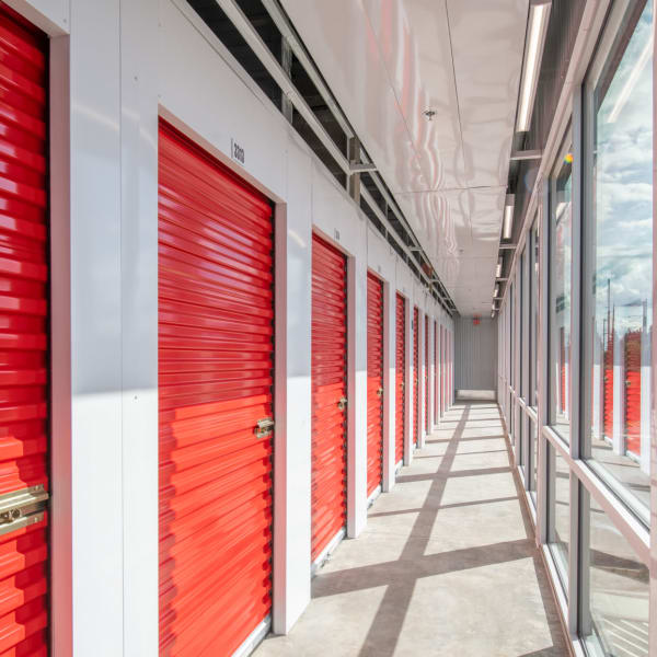 Indoor storage units with bright doors at StorQuest Self Storage in Key West, Florida